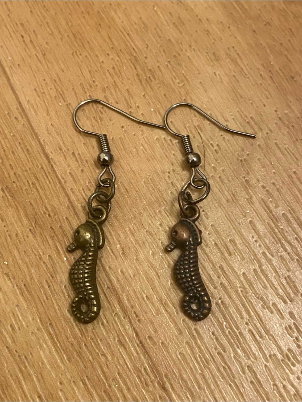 Seahorse Dangle Earrings in Antique Brass